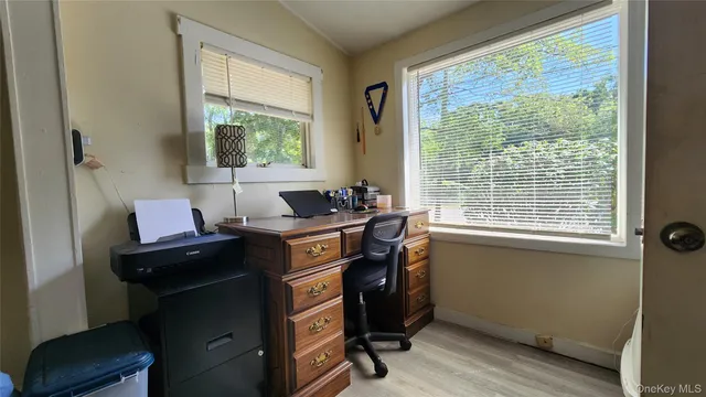 a room with a window and a chair