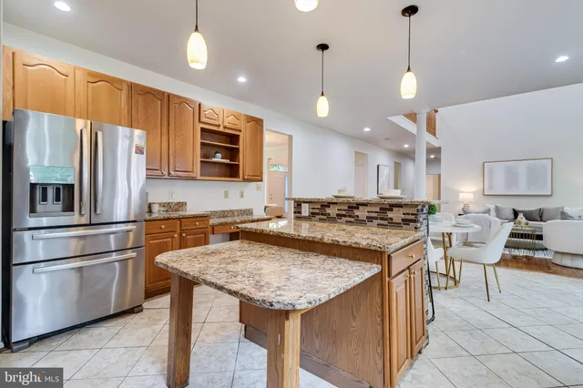 a table and chair in a room with a window