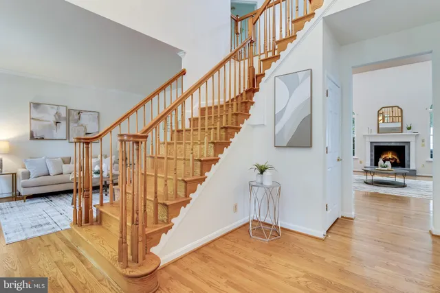 a view of entryway livingroom and hall with wooden floor