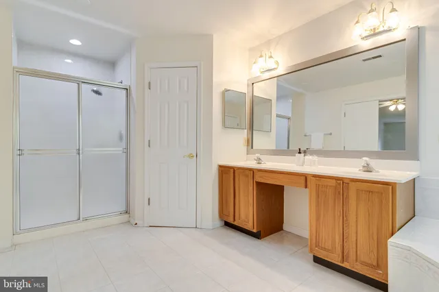 a bedroom with bed and a couch