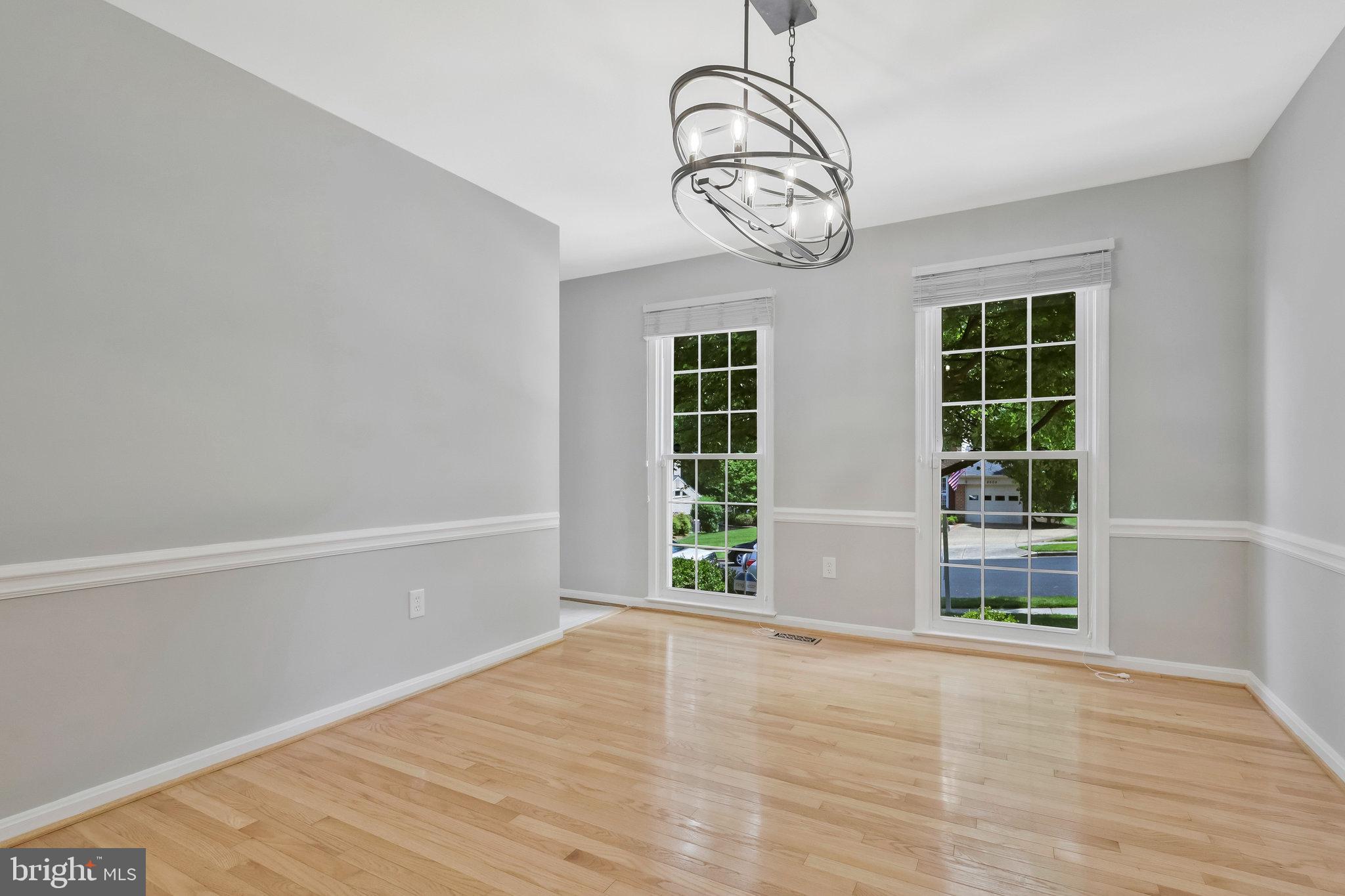 8606 Nanlee Drive Springfield, VA 22152 - Photo 11 of 70 a view of an empty room with wooden floor and a window