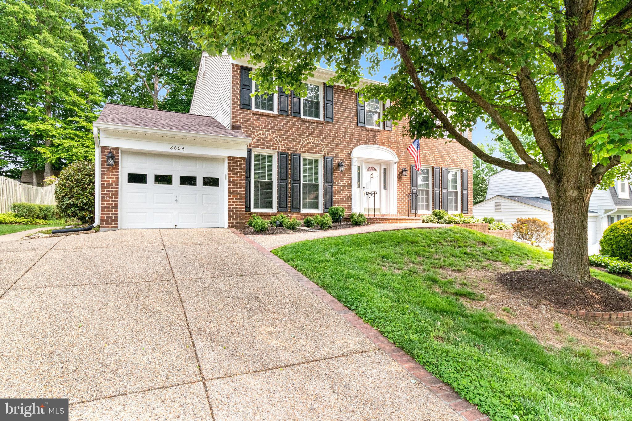 8606 Nanlee Drive Springfield, VA 22152 - Photo 2 of 70 front view of a house with a yard
