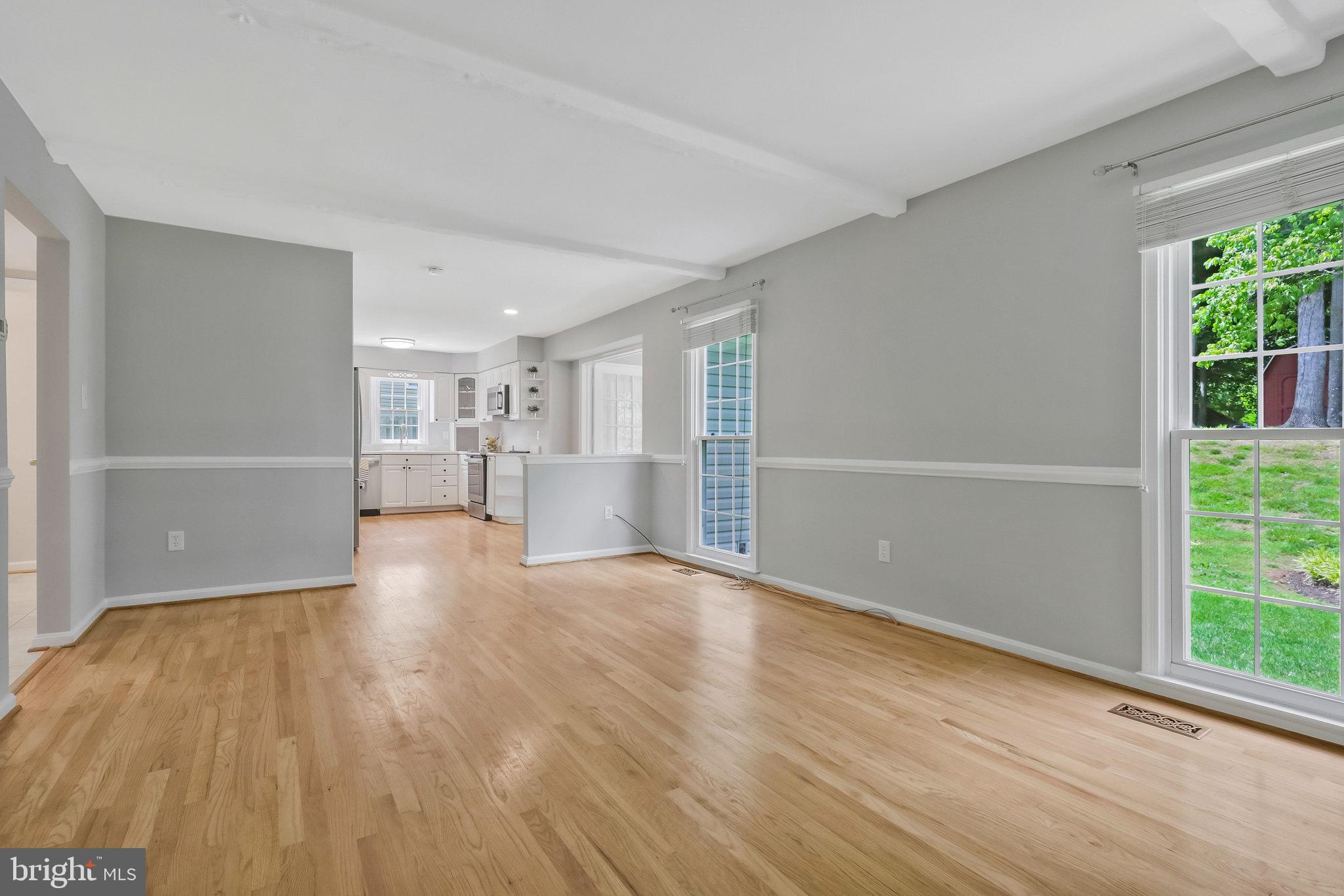 8606 Nanlee Drive Springfield, VA 22152 - Photo 22 of 70 a view of empty room with wooden floor and fireplace