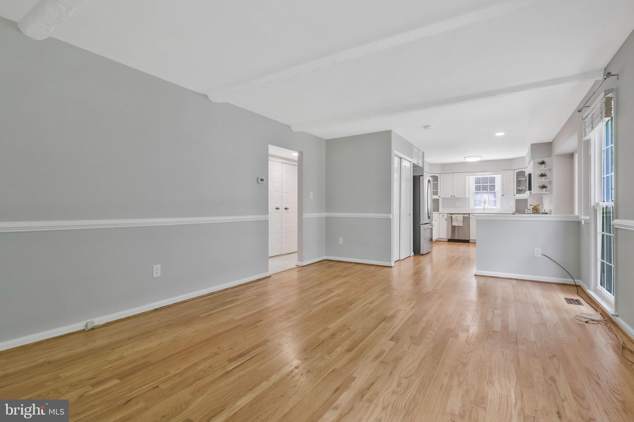 8606 Nanlee Drive Springfield, VA 22152 - Photo 23 of 70 a view of a kitchen with wooden floor and a sink