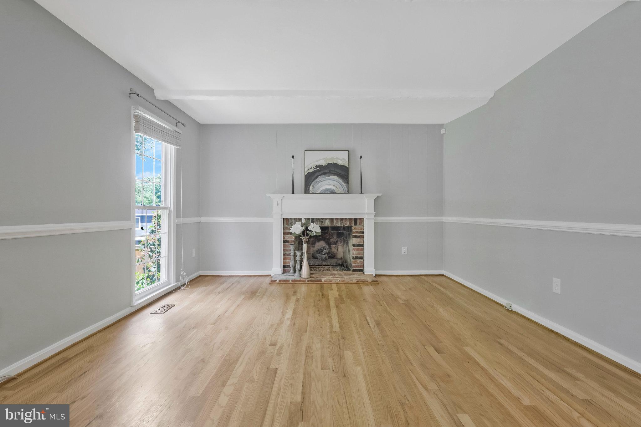 8606 Nanlee Drive Springfield, VA 22152 - Photo 26 of 70 wooden floor in an empty room with a window