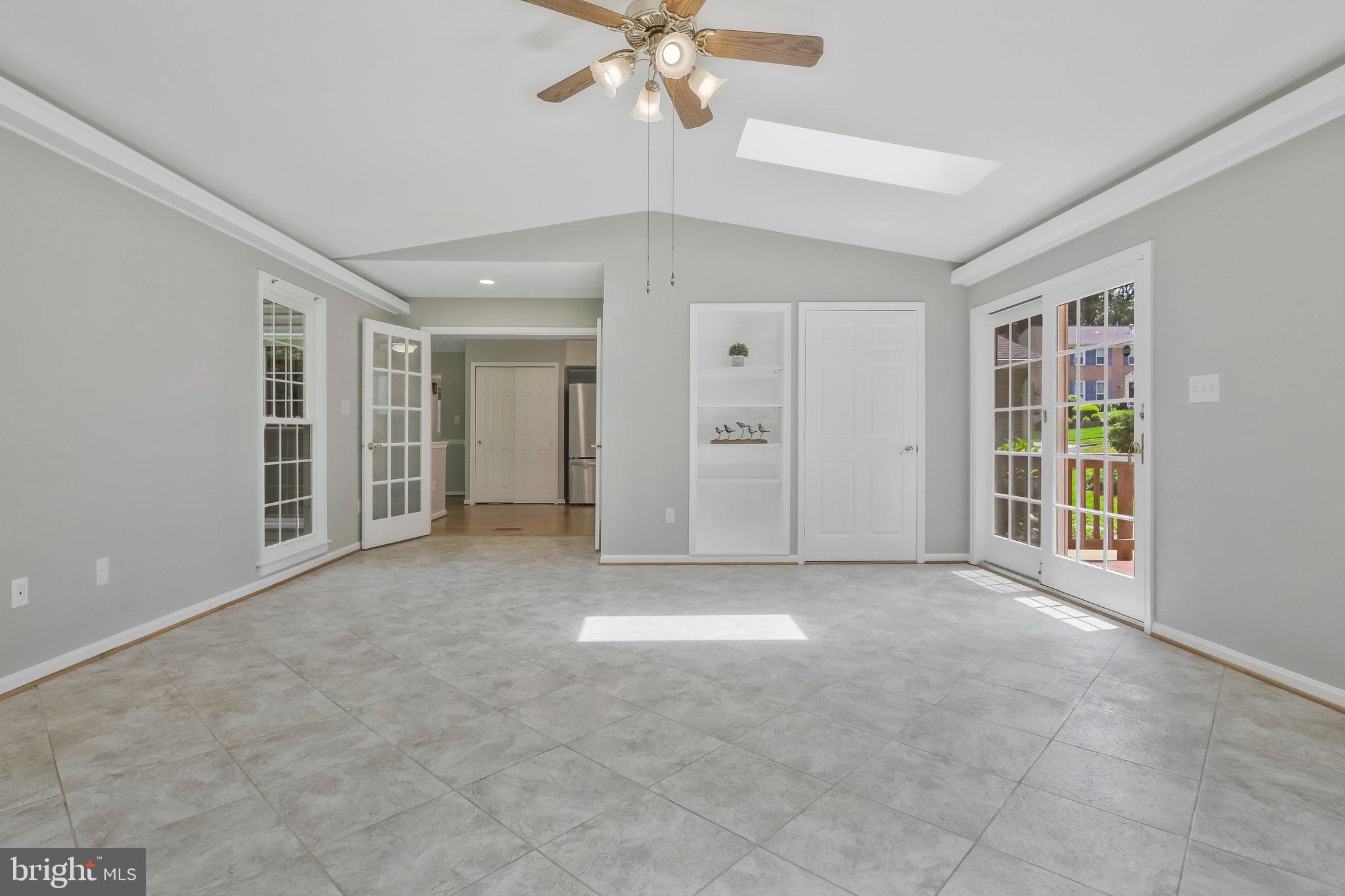 8606 Nanlee Drive Springfield, VA 22152 - Photo 32 of 70 en empty room with windows and ceiling fan