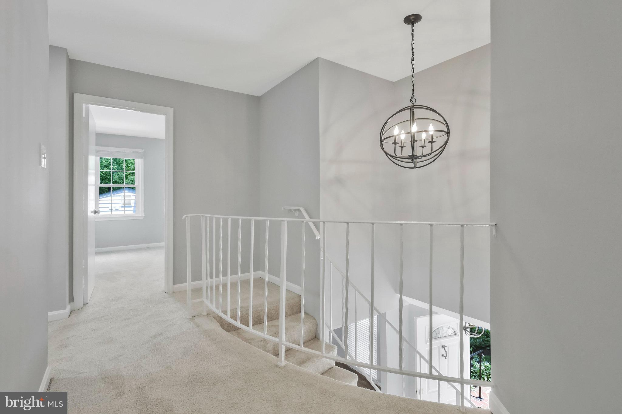 8606 Nanlee Drive Springfield, VA 22152 - Photo 35 of 70 a view of a hallway with windows