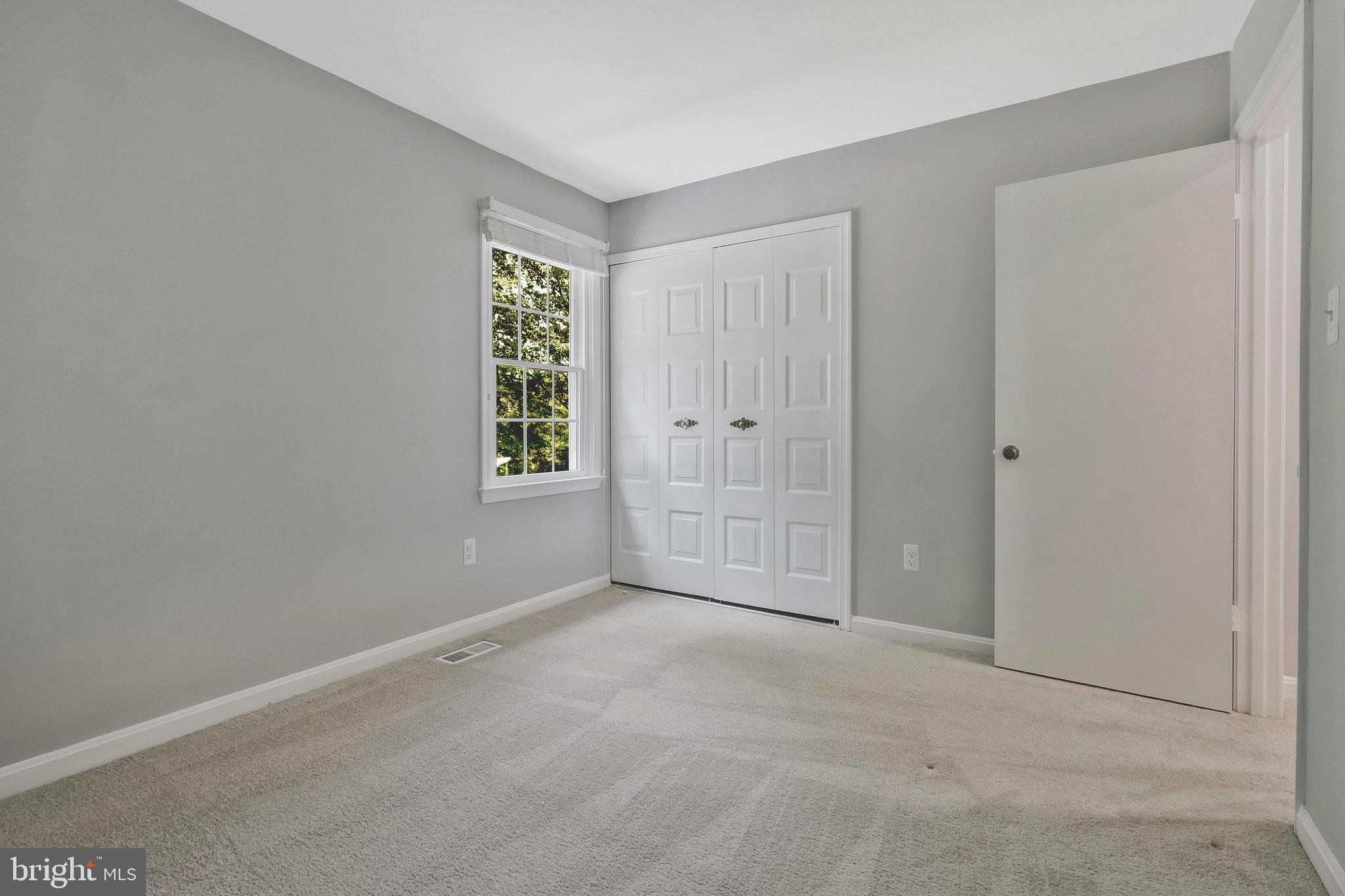 8606 Nanlee Drive Springfield, VA 22152 - Photo 46 of 70 a view of an empty room with window and closet area