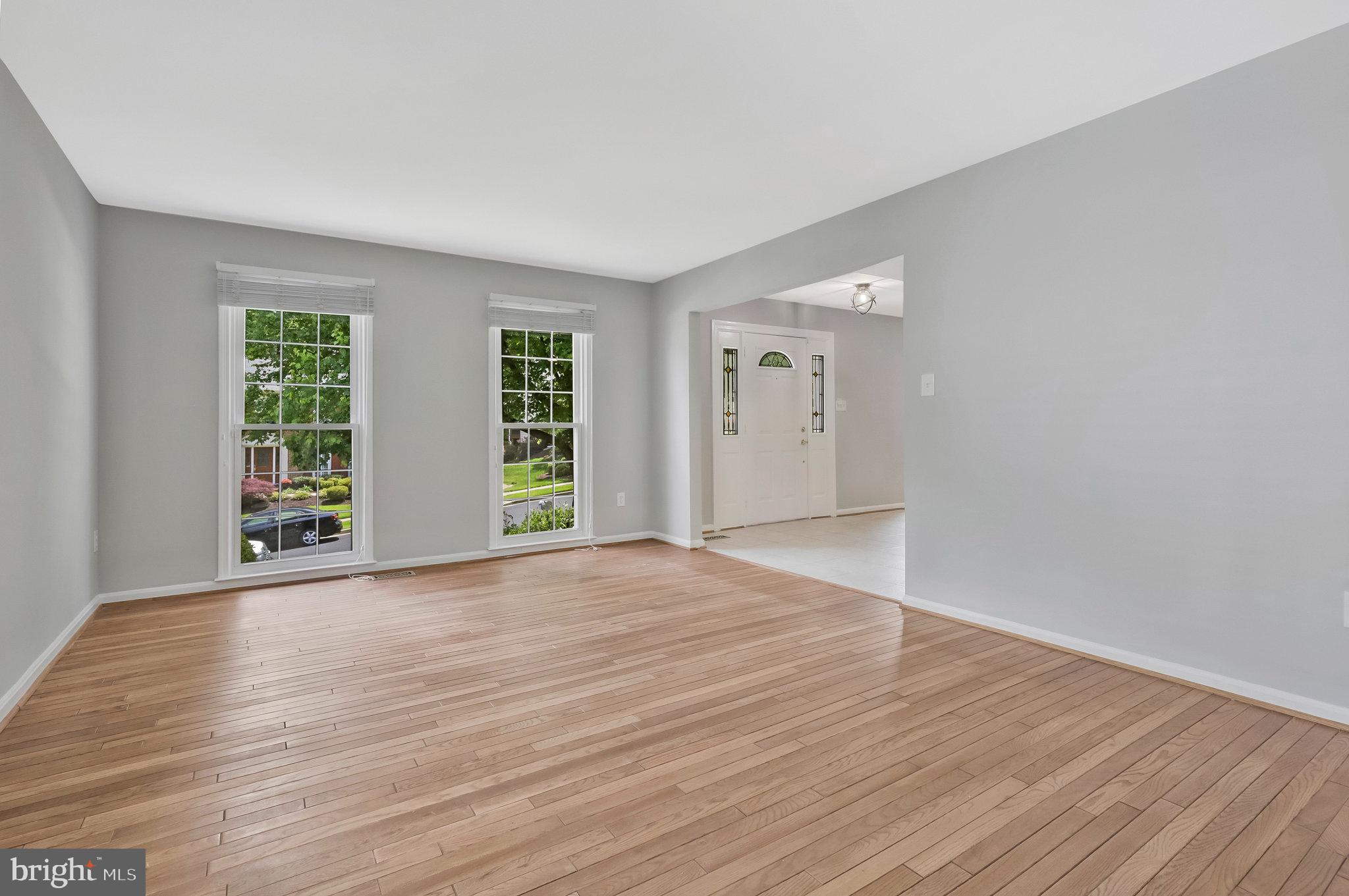 8606 Nanlee Drive Springfield, VA 22152 - Photo 6 of 70 a view of an empty room with wooden floor and a window