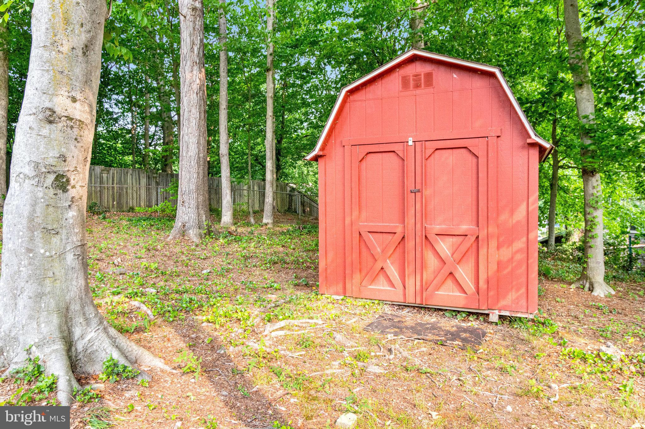8606 Nanlee Drive Springfield, VA 22152 - Photo 68 of 70 a view of backyard of house with green space and wooden fence