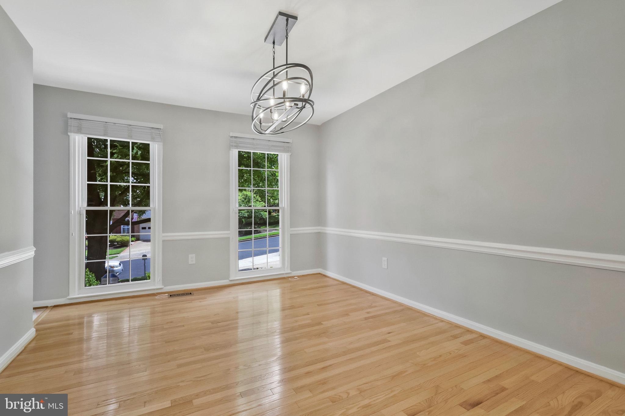 8606 Nanlee Drive Springfield, VA 22152 - Photo 9 of 70 a view of empty room with wooden floor and windows