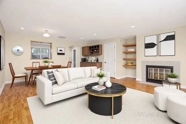 a living room with furniture and a fireplace