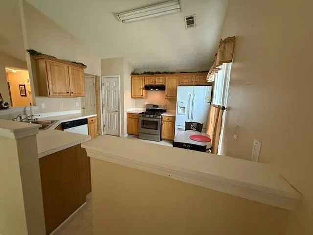 a view of kitchen and wooden floor