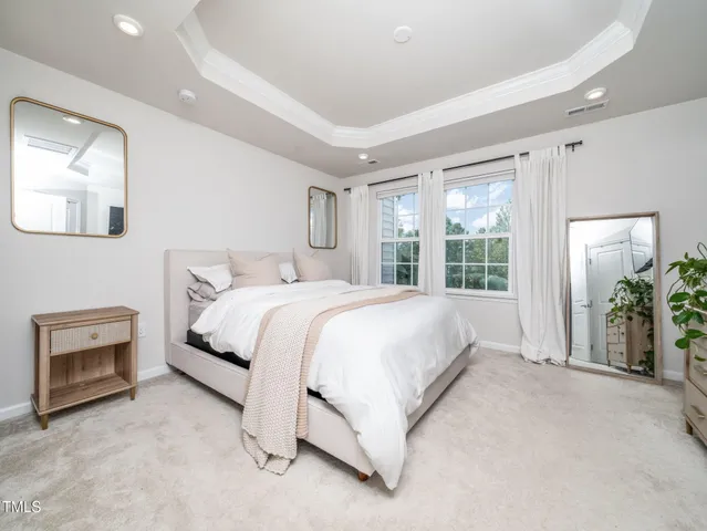 a bed room with a bed and a view of en suite bathroom