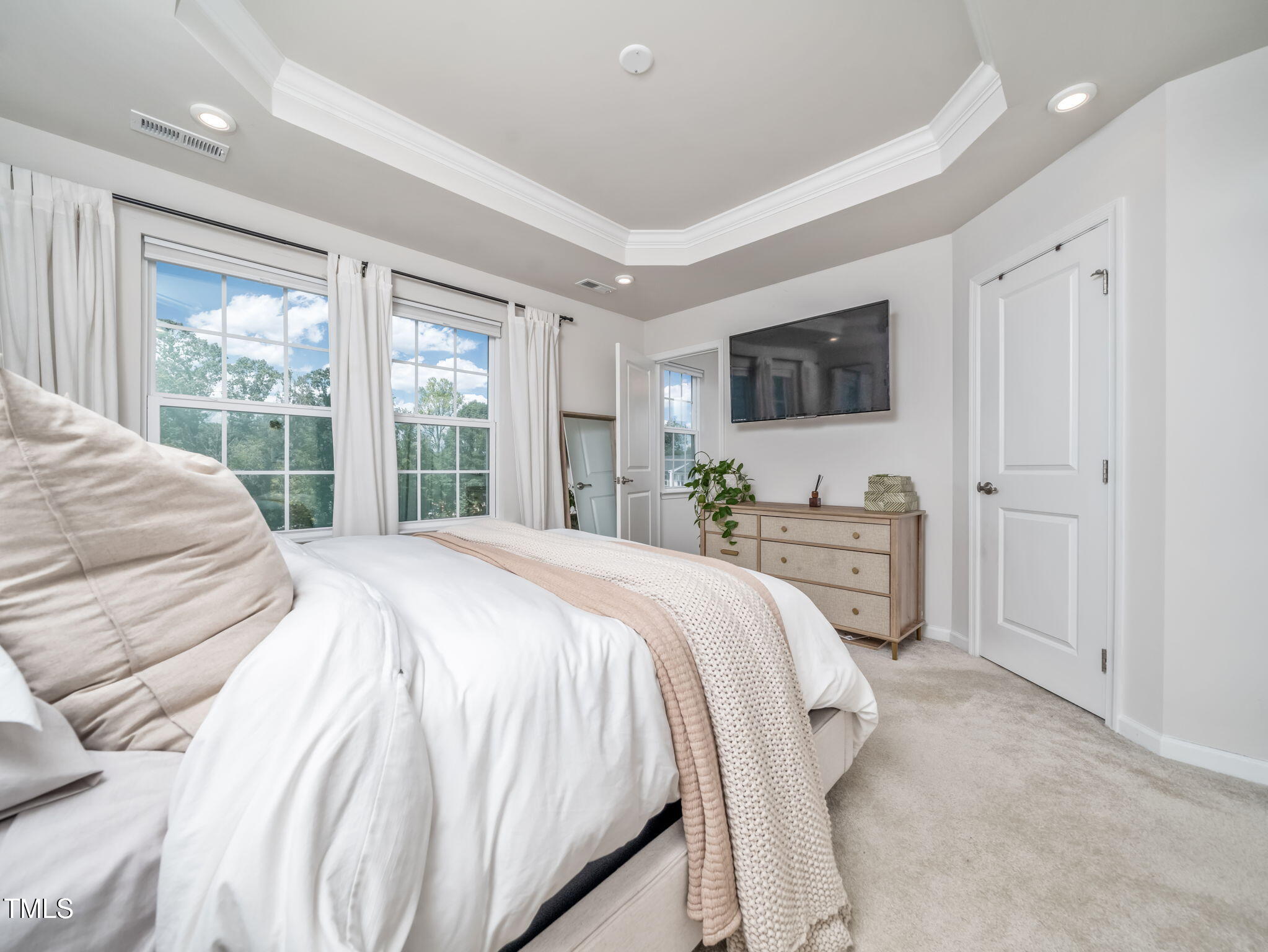 6429 Pathfinder Way Raleigh, NC 27616 - Photo 12 of 18 a spacious bedroom with a bed and a flat screen tv