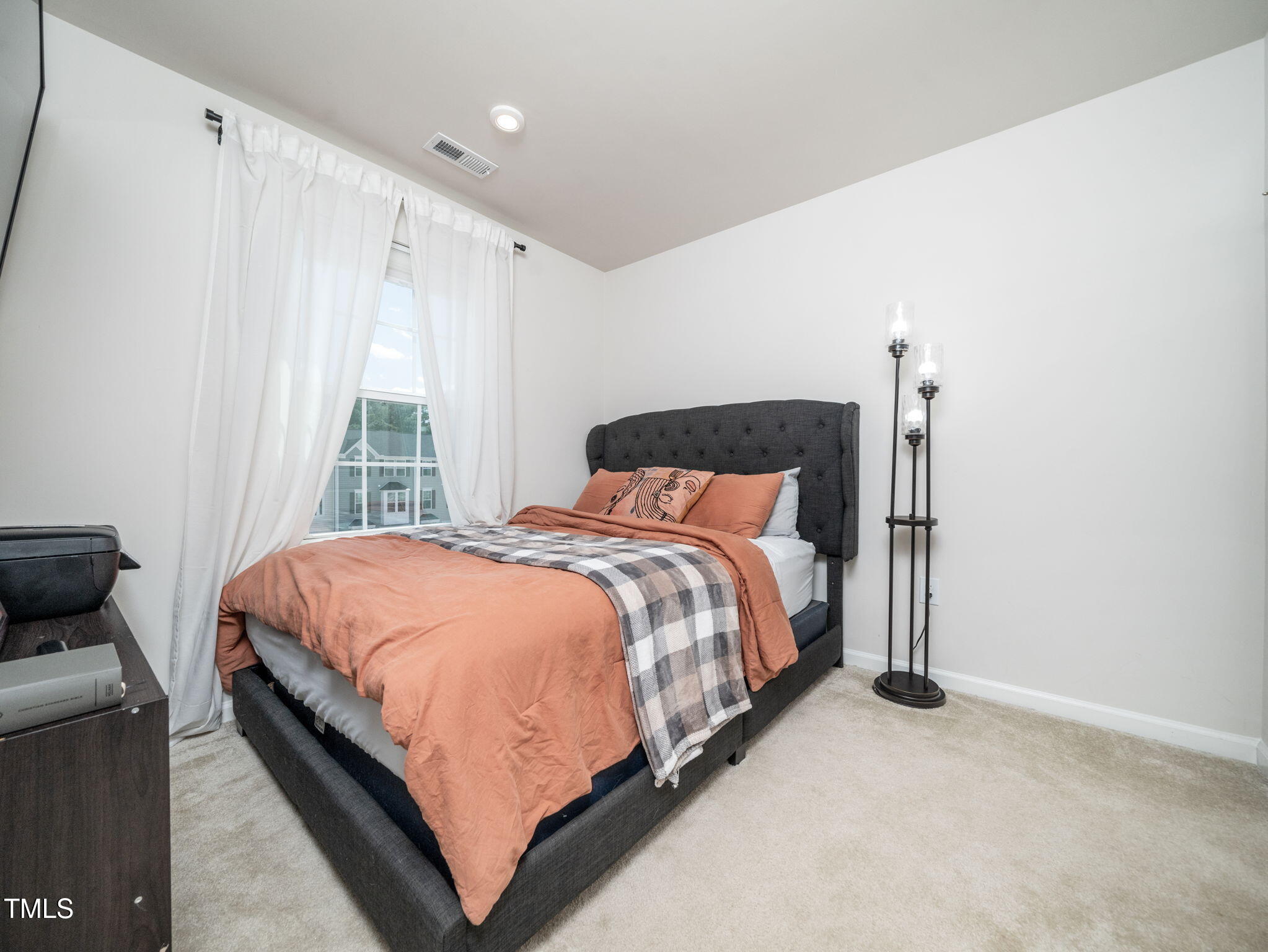 6429 Pathfinder Way Raleigh, NC 27616 - Photo 13 of 18 a bedroom with a bed and window