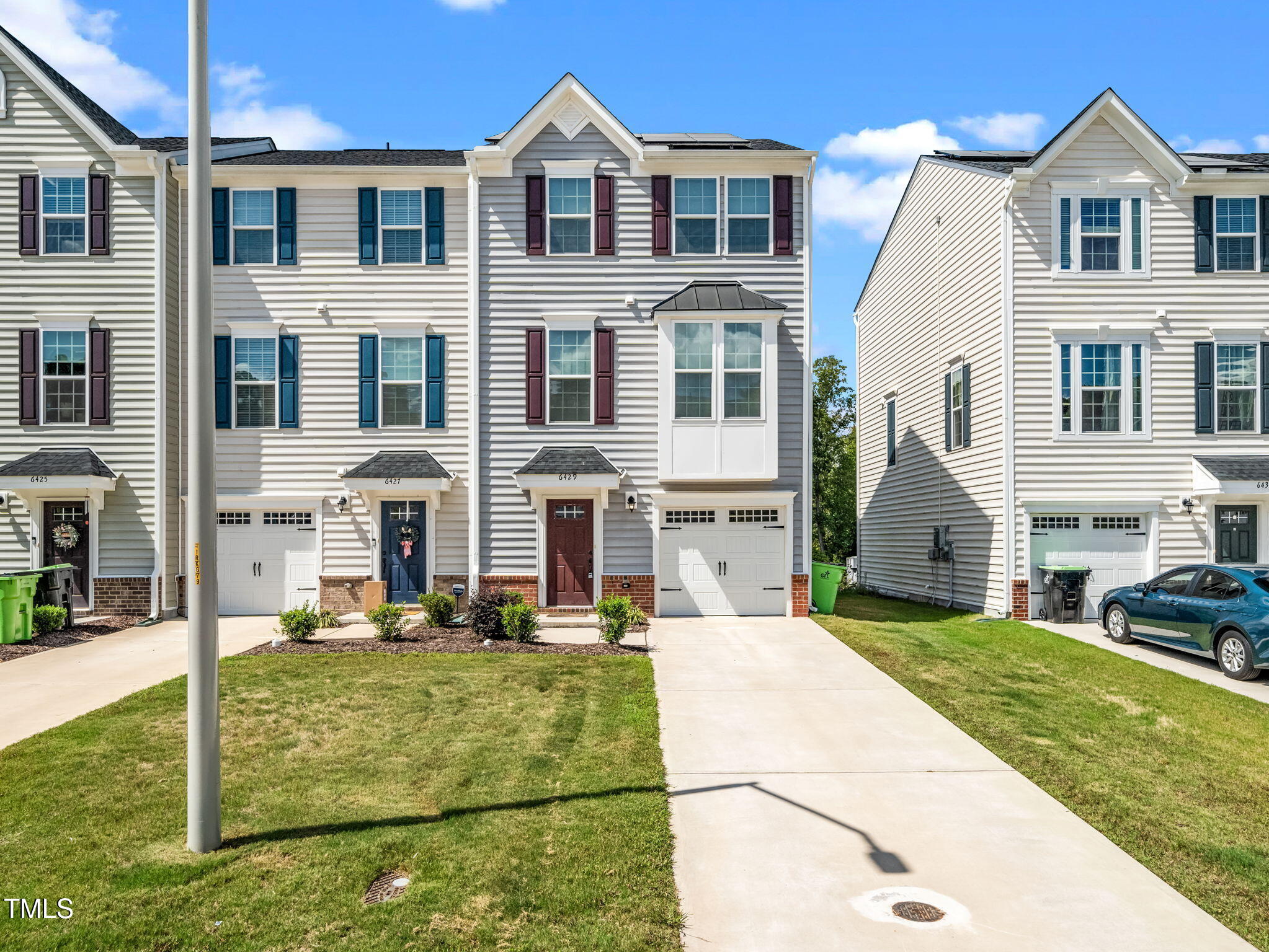 6429 Pathfinder Way Raleigh, NC 27616 - Photo 2 of 18 a front view of a house with garden