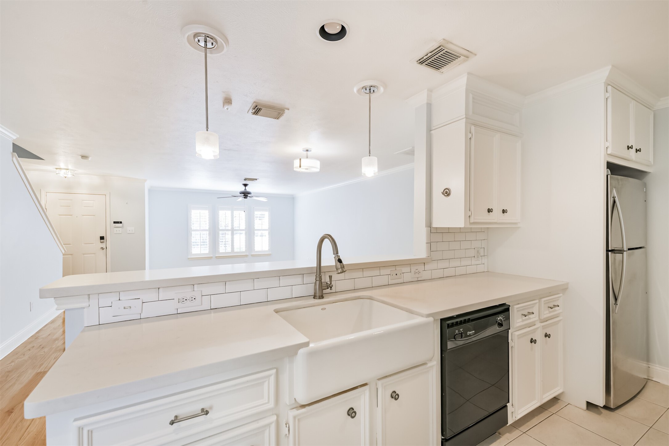 738 Redwing Pl Drive Houston, TX 77009 - Photo 16 of 23 View from the kitchen looking out to the living room, note the kitchen features a Farmhouse style sink.