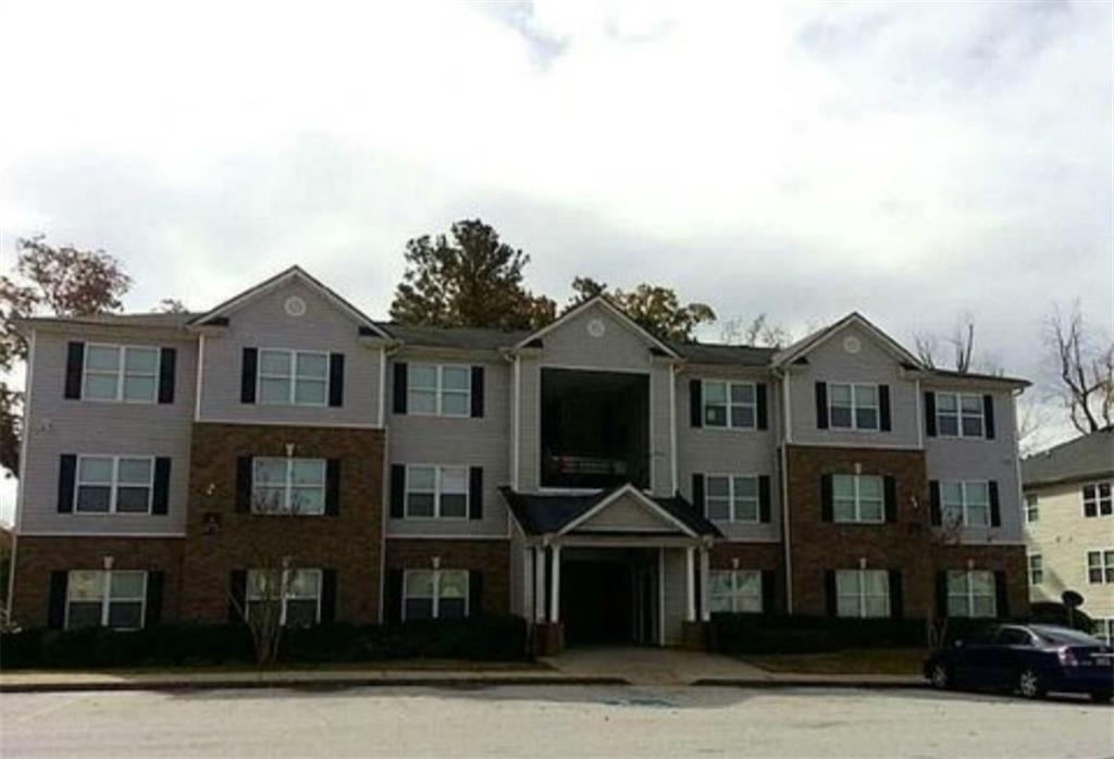 8104 Waldrop Place Decatur, GA 30034 - Photo 1 of 1 a front view of a residential apartment building with a yard