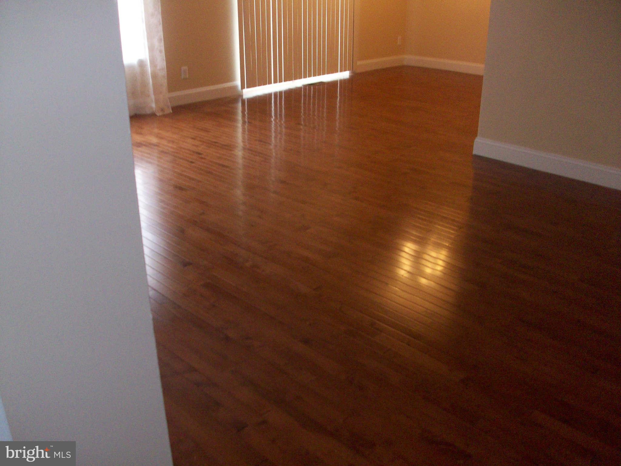 3105 Berry Road Northeast, Unit 11 Washington, DC 20018 - Photo 5 of 8 a view of a room with wooden floor