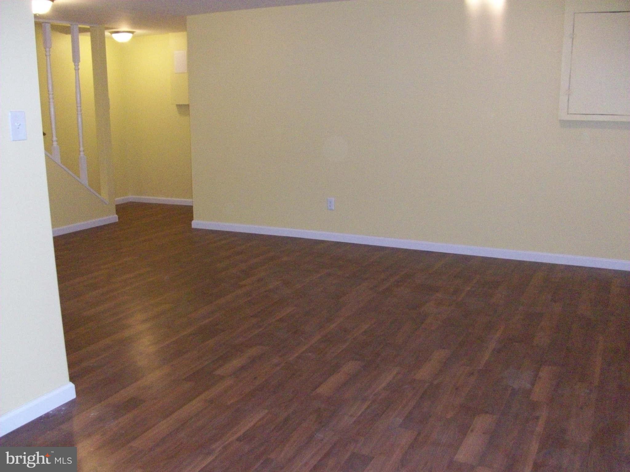 3105 Berry Road Northeast, Unit 11 Washington, DC 20018 - Photo 8 of 8 a view of a room with wooden floor