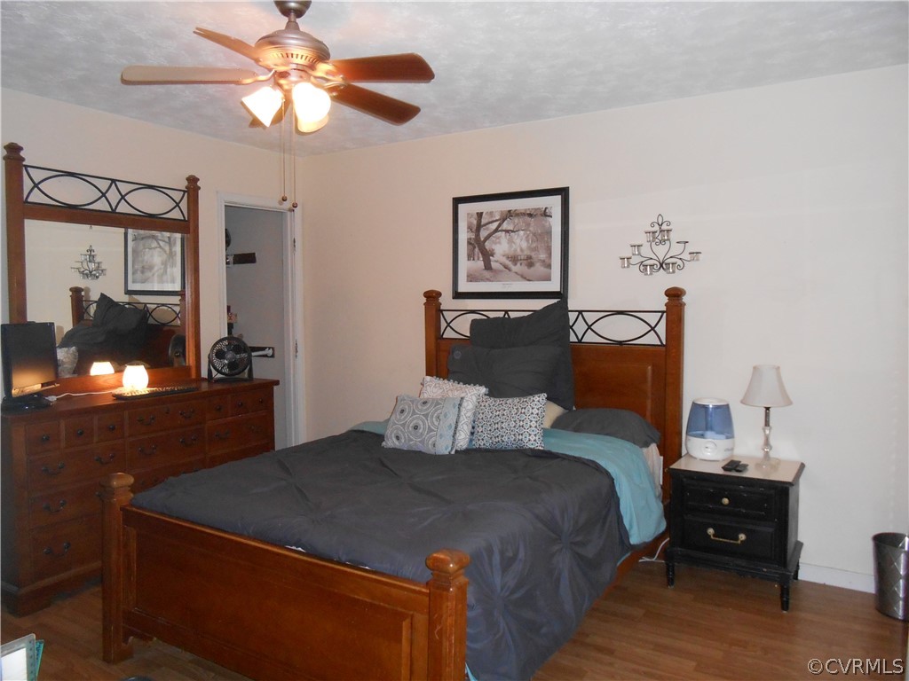 3132 Fielding Road Chester, VA 23831 - Photo 11 of 28 a bedroom with a bed and a chandelier