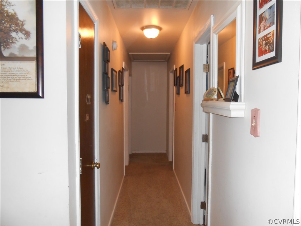 3132 Fielding Road Chester, VA 23831 - Photo 16 of 28 a view of a hallway with wooden floor
