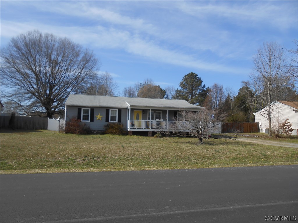 3132 Fielding Road Chester, VA 23831 - Photo 2 of 28 a front view of a house with a garden and trees