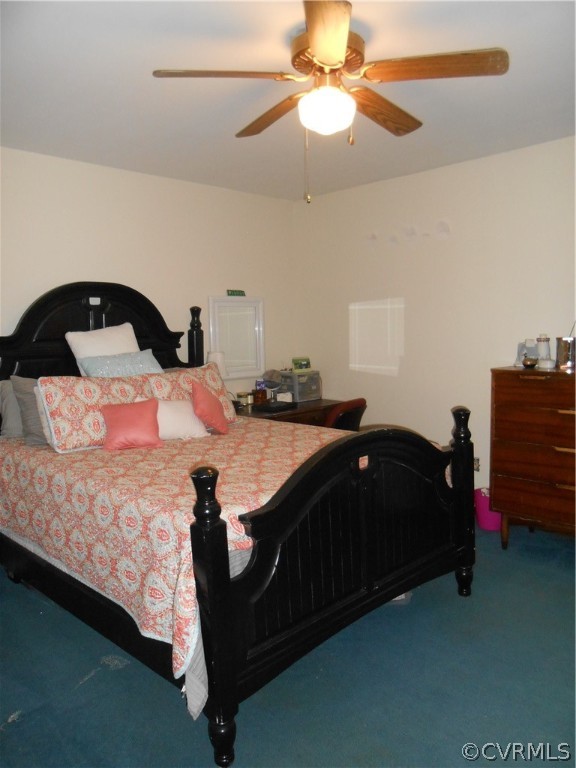 3132 Fielding Road Chester, VA 23831 - Photo 22 of 28 a bedroom with a bed and a chandelier
