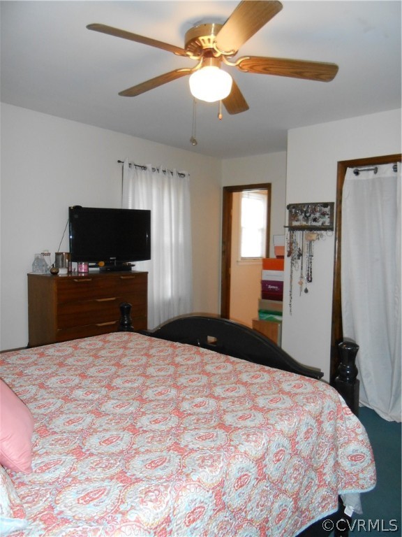 3132 Fielding Road Chester, VA 23831 - Photo 23 of 28 a bedroom with a bed and a flat screen tv