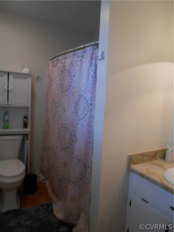 3132 Fielding Road Chester, VA 23831 - Photo 27 of 28 a bathroom with a granite countertop toilet and a sink