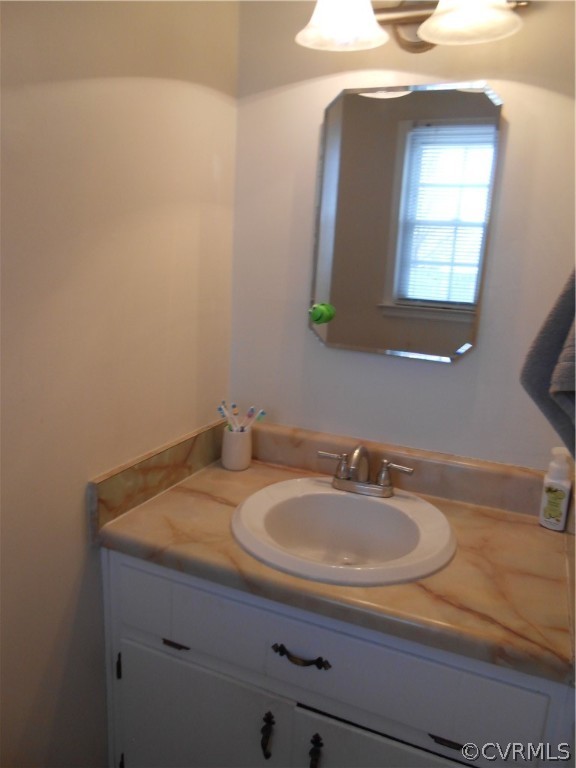 3132 Fielding Road Chester, VA 23831 - Photo 28 of 28 a bathroom with a sink and a mirror
