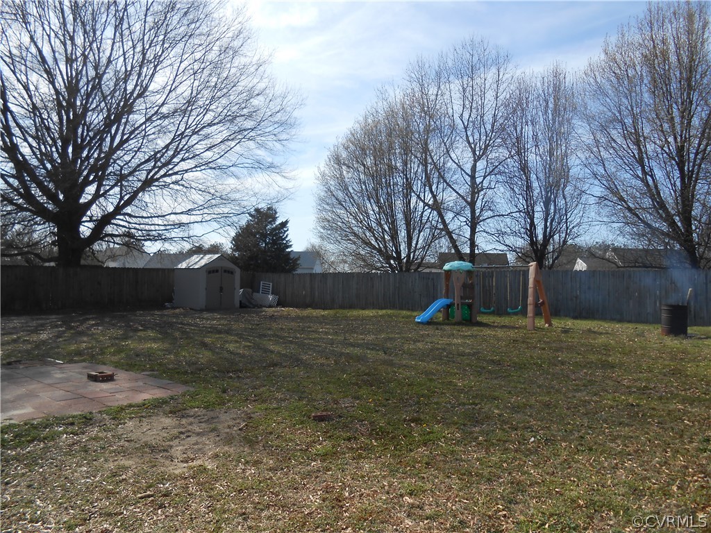 3132 Fielding Road Chester, VA 23831 - Photo 5 of 28 a backyard of a house and trees