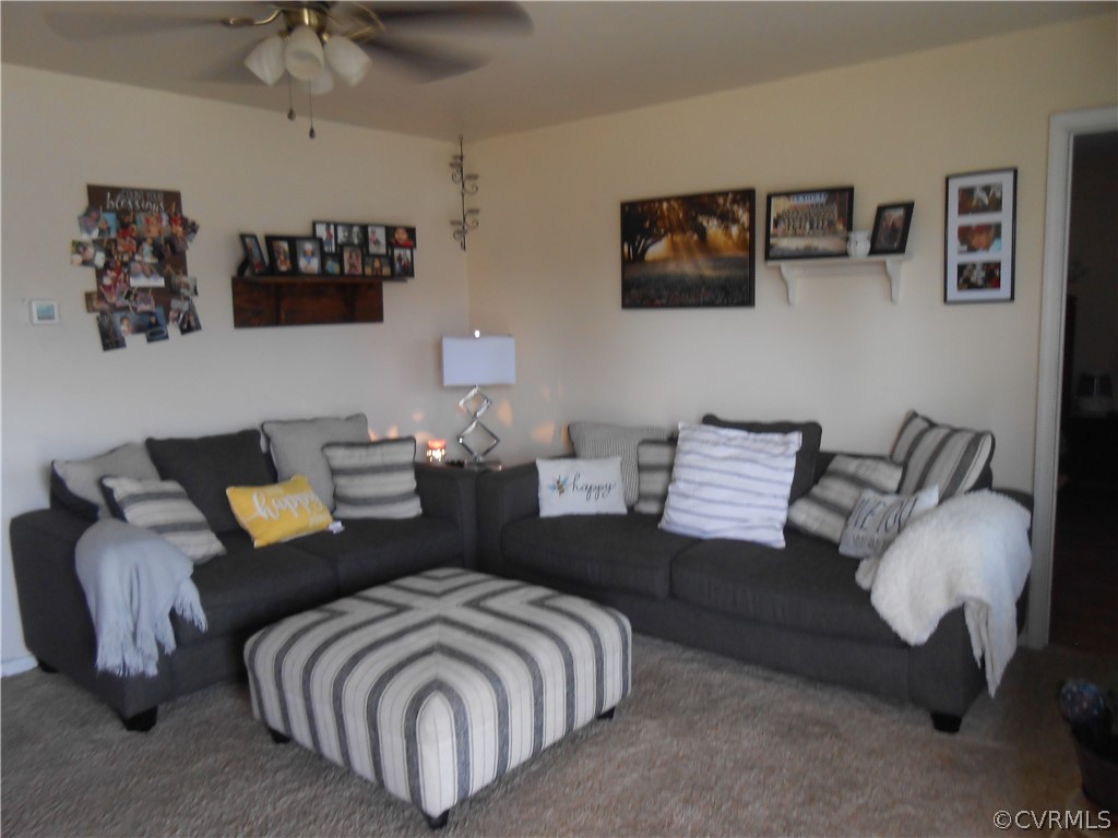 3132 Fielding Road Chester, VA 23831 - Photo 9 of 28 a living room with furniture and a lamp