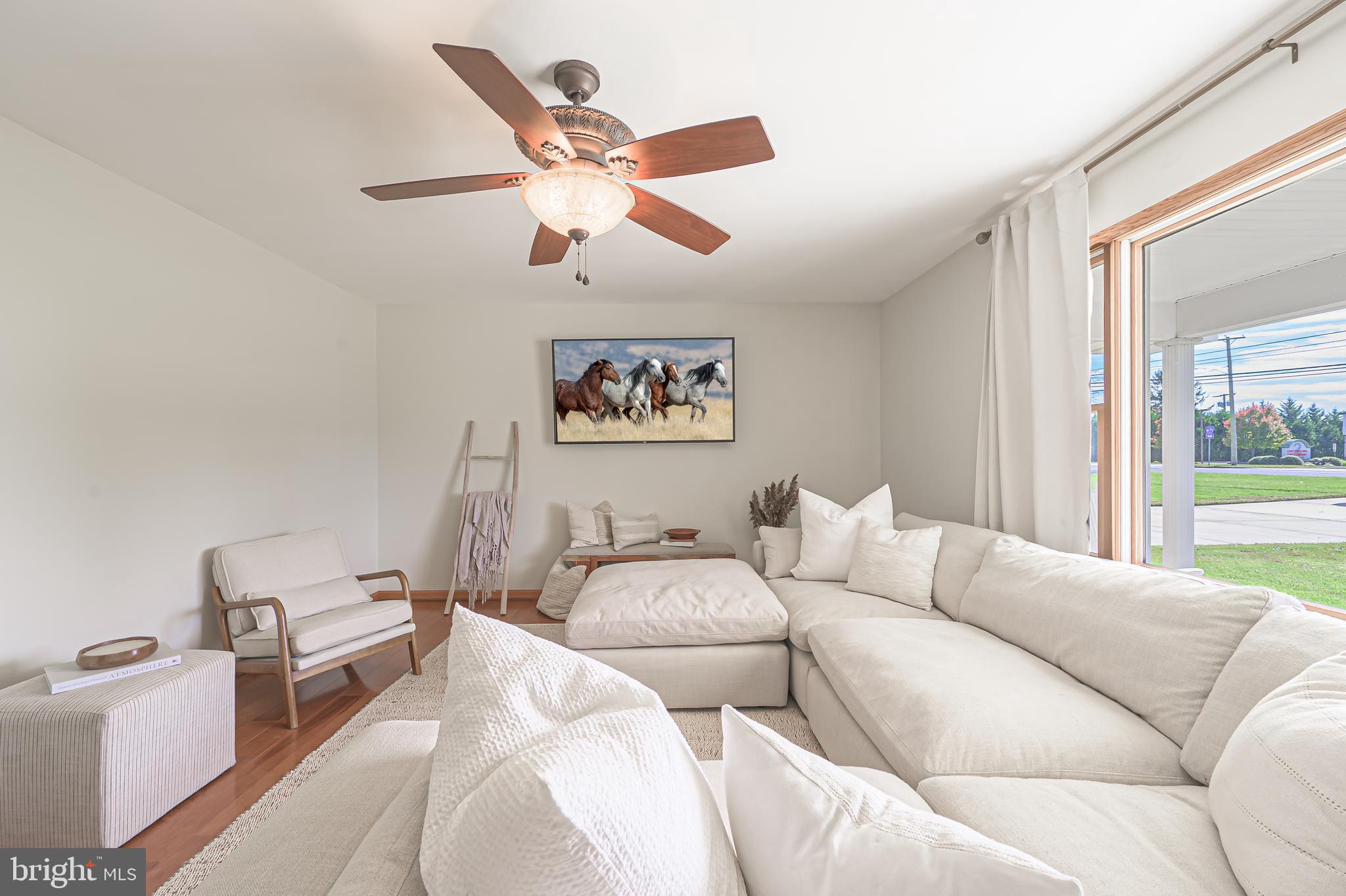 4926 Landis Avenue Vineland, NJ 08360 - Photo 11 of 73 a living room with a couch and a window