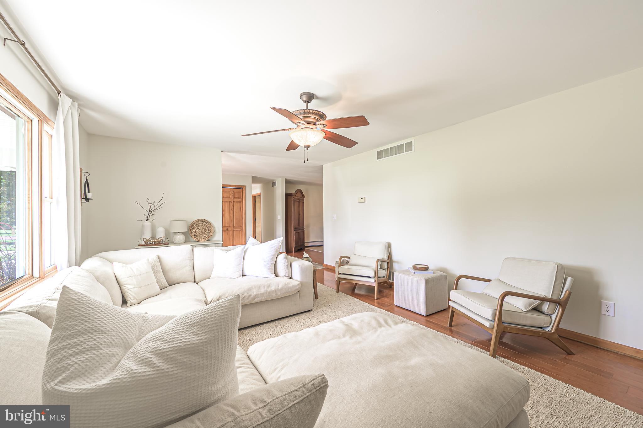 4926 Landis Avenue Vineland, NJ 08360 - Photo 12 of 73 a living room with furniture and a large window
