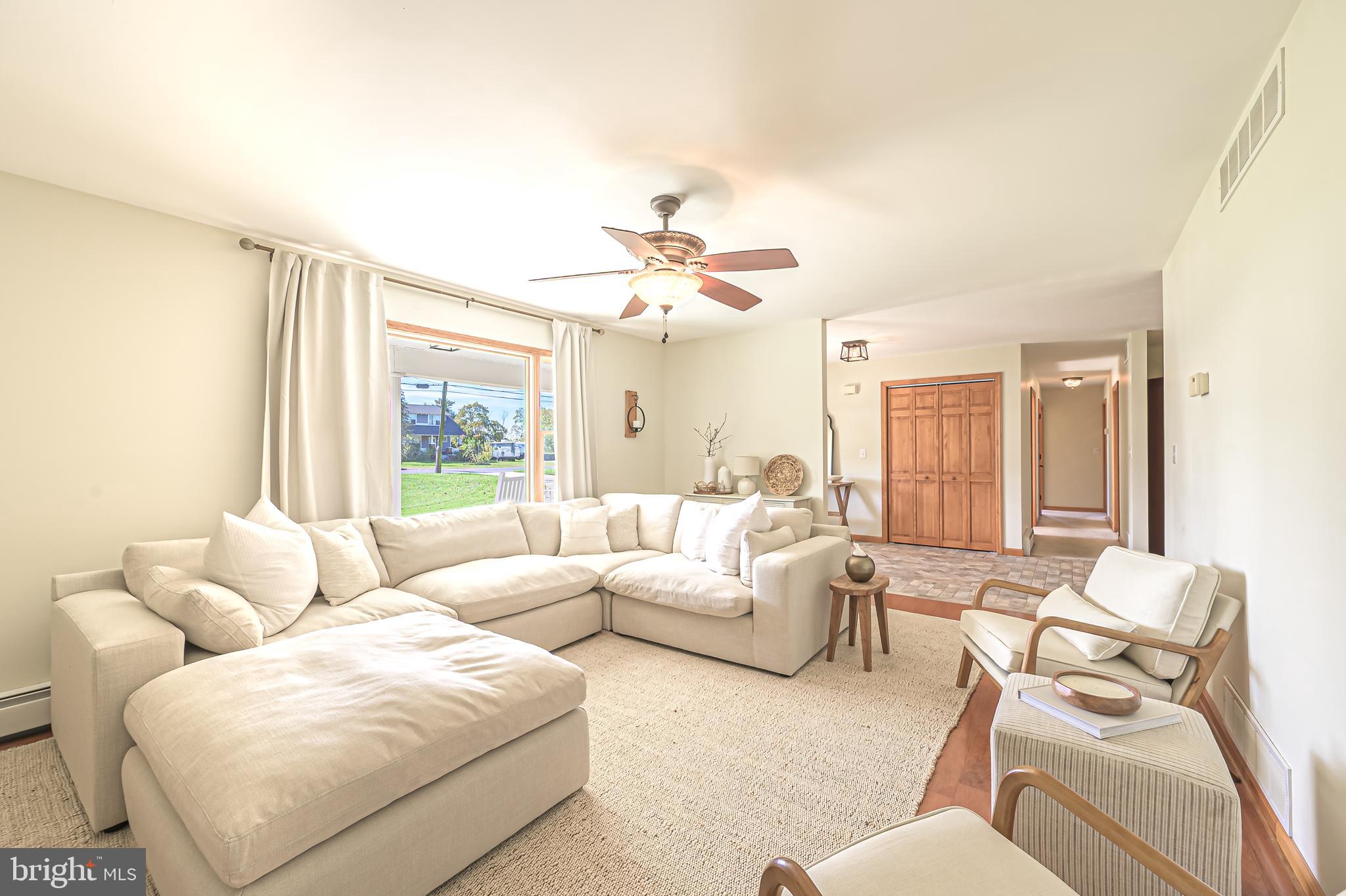 4926 Landis Avenue Vineland, NJ 08360 - Photo 13 of 73 a living room with furniture and a large window