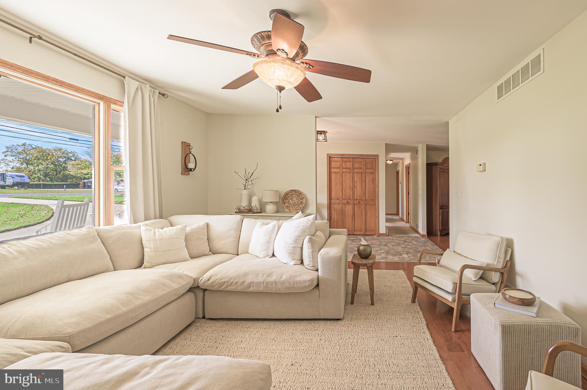 4926 Landis Avenue Vineland, NJ 08360 - Photo 14 of 73 a living room with furniture and a large window
