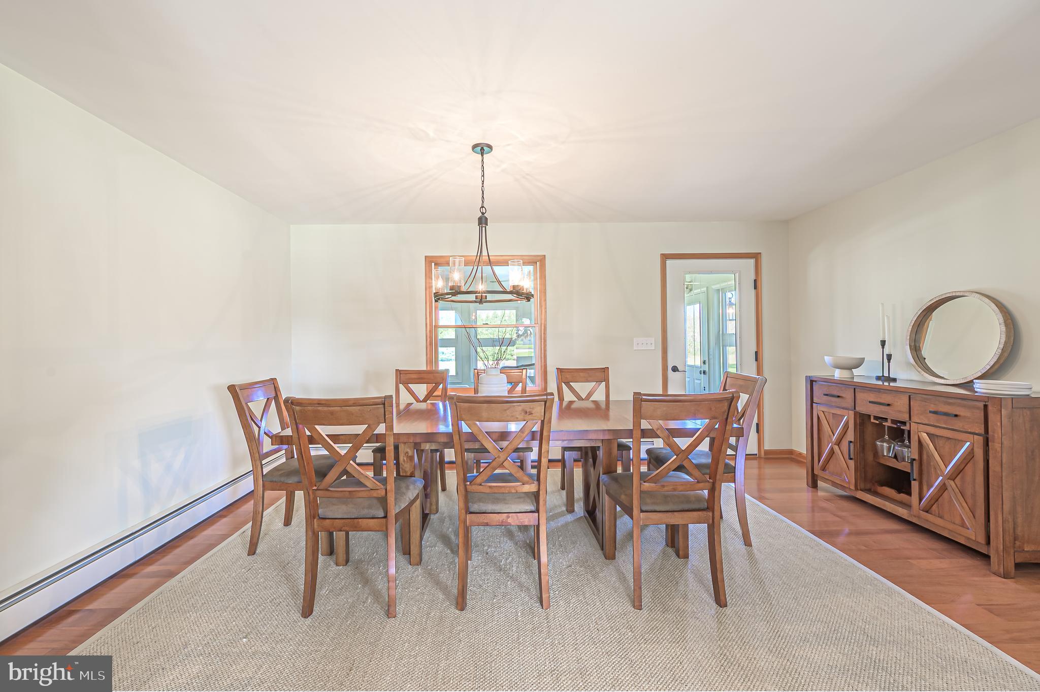 4926 Landis Avenue Vineland, NJ 08360 - Photo 15 of 73 a view of a dining room with furniture window and wooden floor