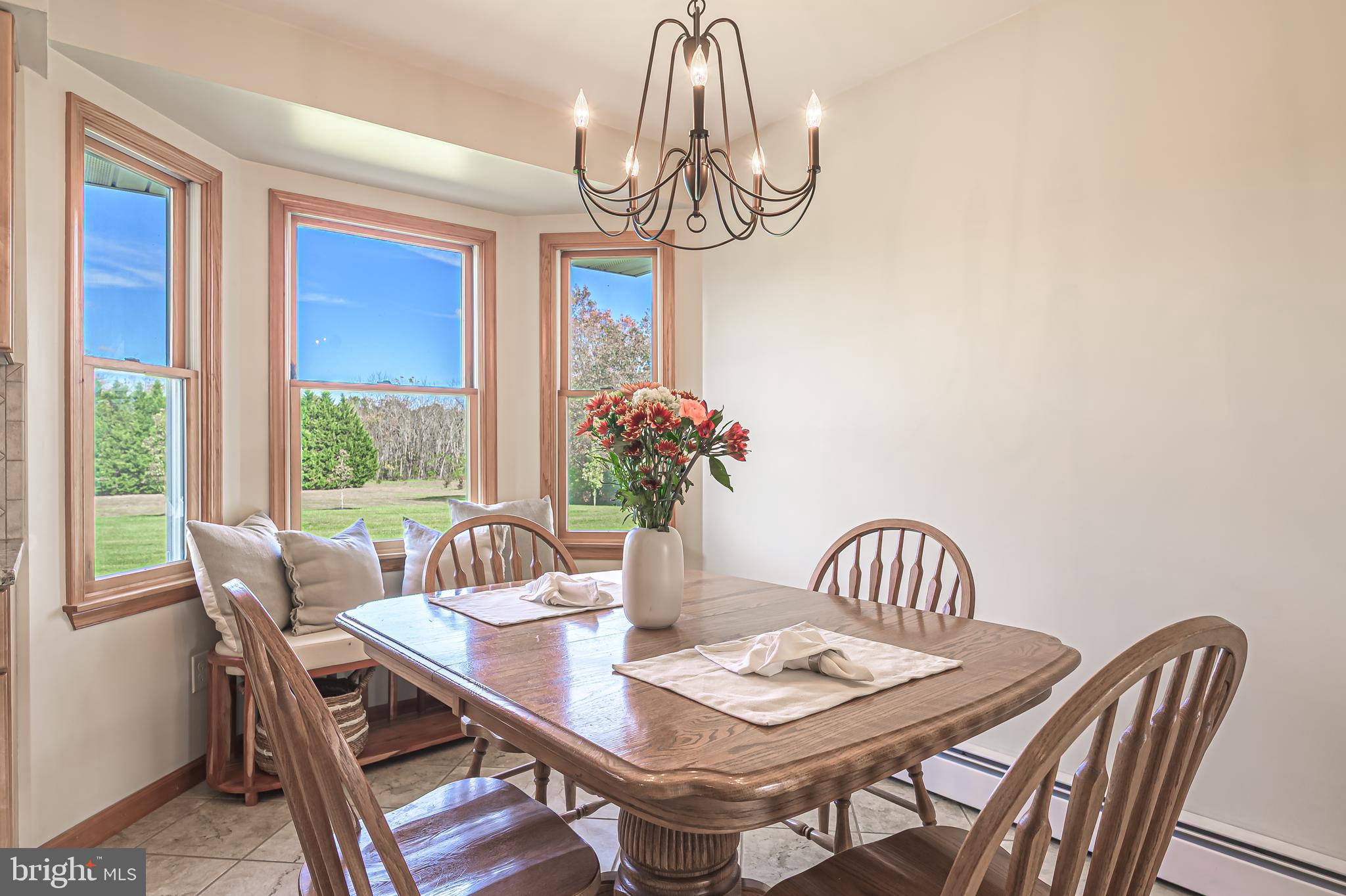 4926 Landis Avenue Vineland, NJ 08360 - Photo 24 of 73 a view of a dining room with furniture window and chandelier
