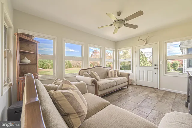 a room with gym equipment and windows