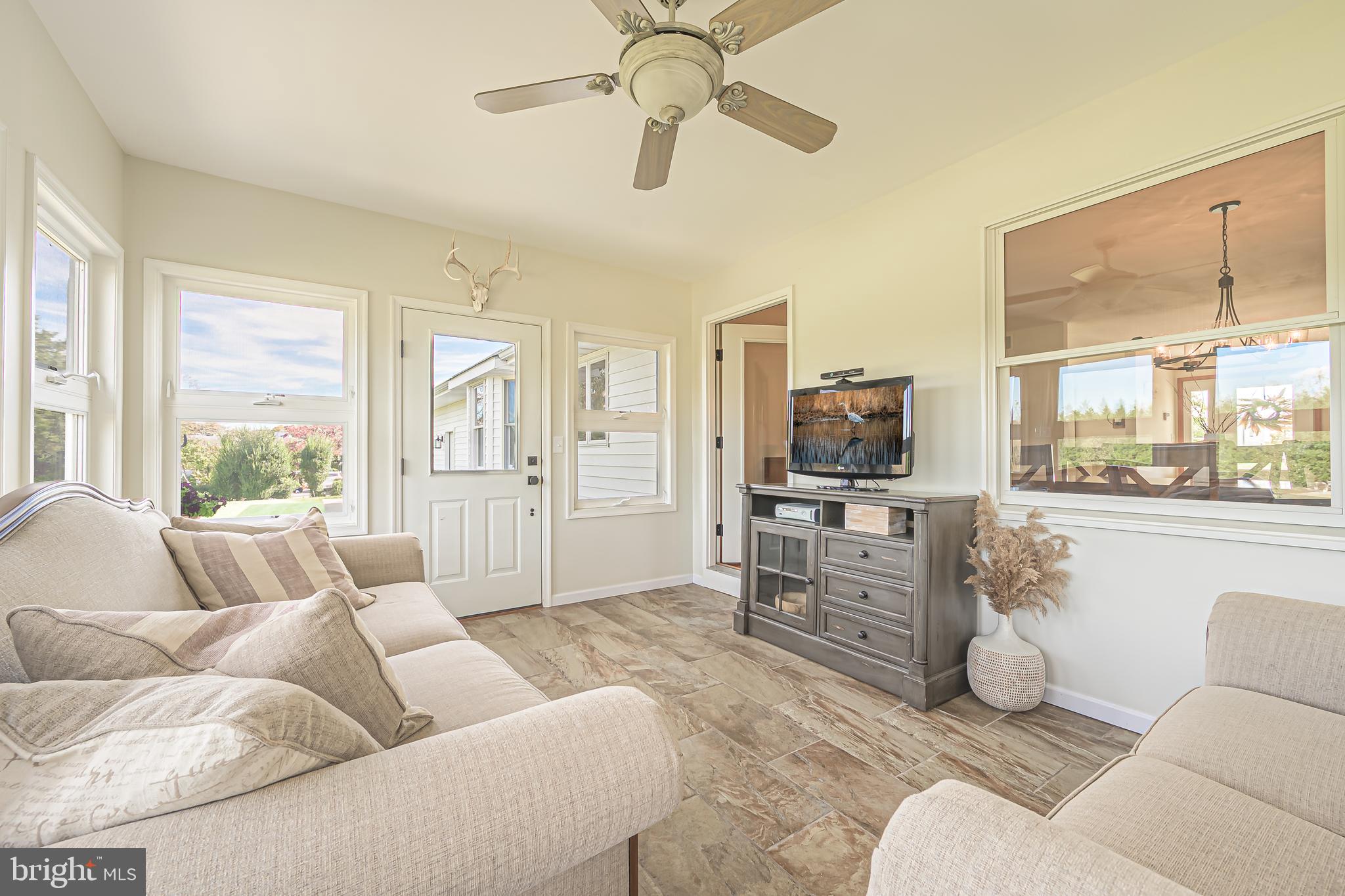 4926 Landis Avenue Vineland, NJ 08360 - Photo 31 of 73 a living room with furniture and a large window