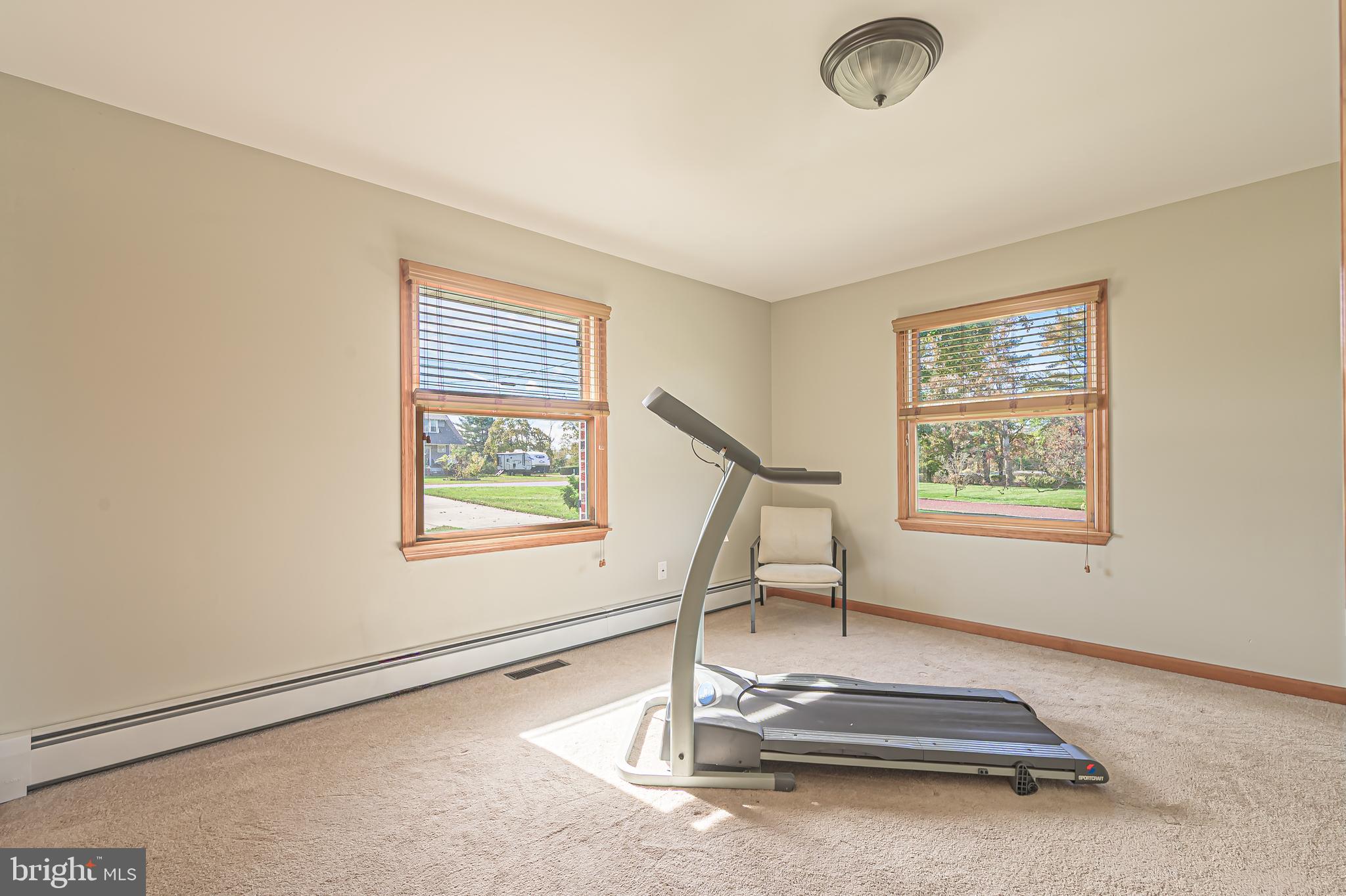 4926 Landis Avenue Vineland, NJ 08360 - Photo 39 of 73 a room with gym equipment and windows