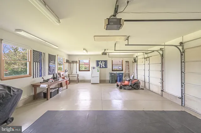 a view of a swimming pool with an outdoor seating and yard