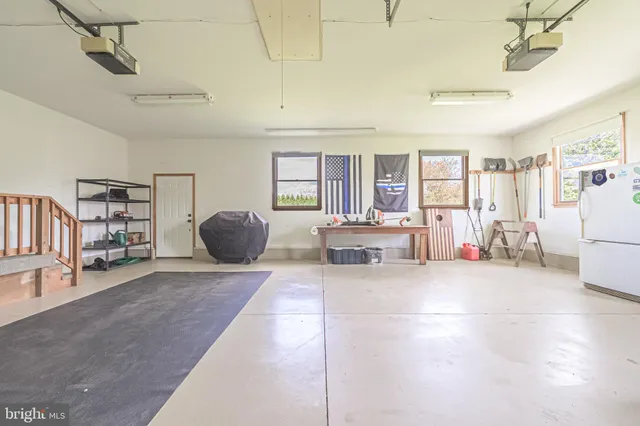 an aerial view of residential building and lake