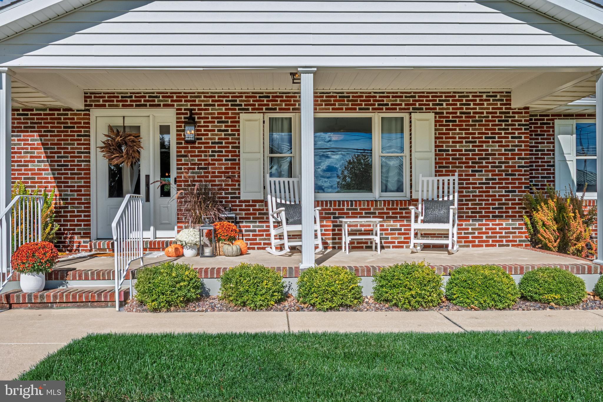 4926 Landis Avenue Vineland, NJ 08360 - Photo 5 of 73 a front view of a house with a yard and plants