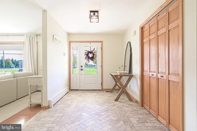 a view of an empty room and bathroom