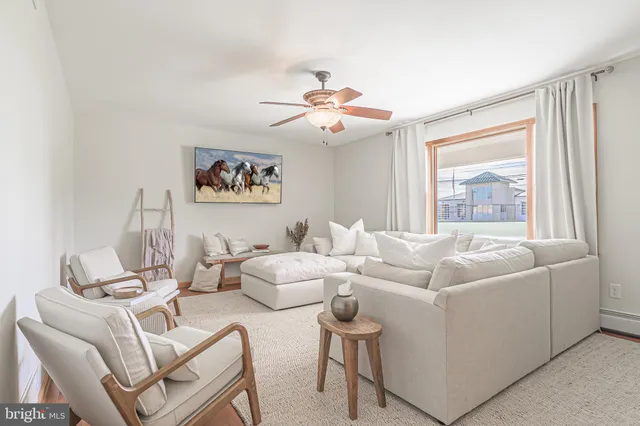 a living room with a couch and a window