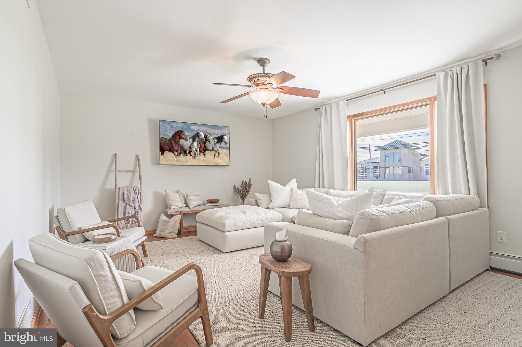 4926 Landis Avenue Vineland, NJ 08360 - Photo 10 of 73 a living room with furniture and a window