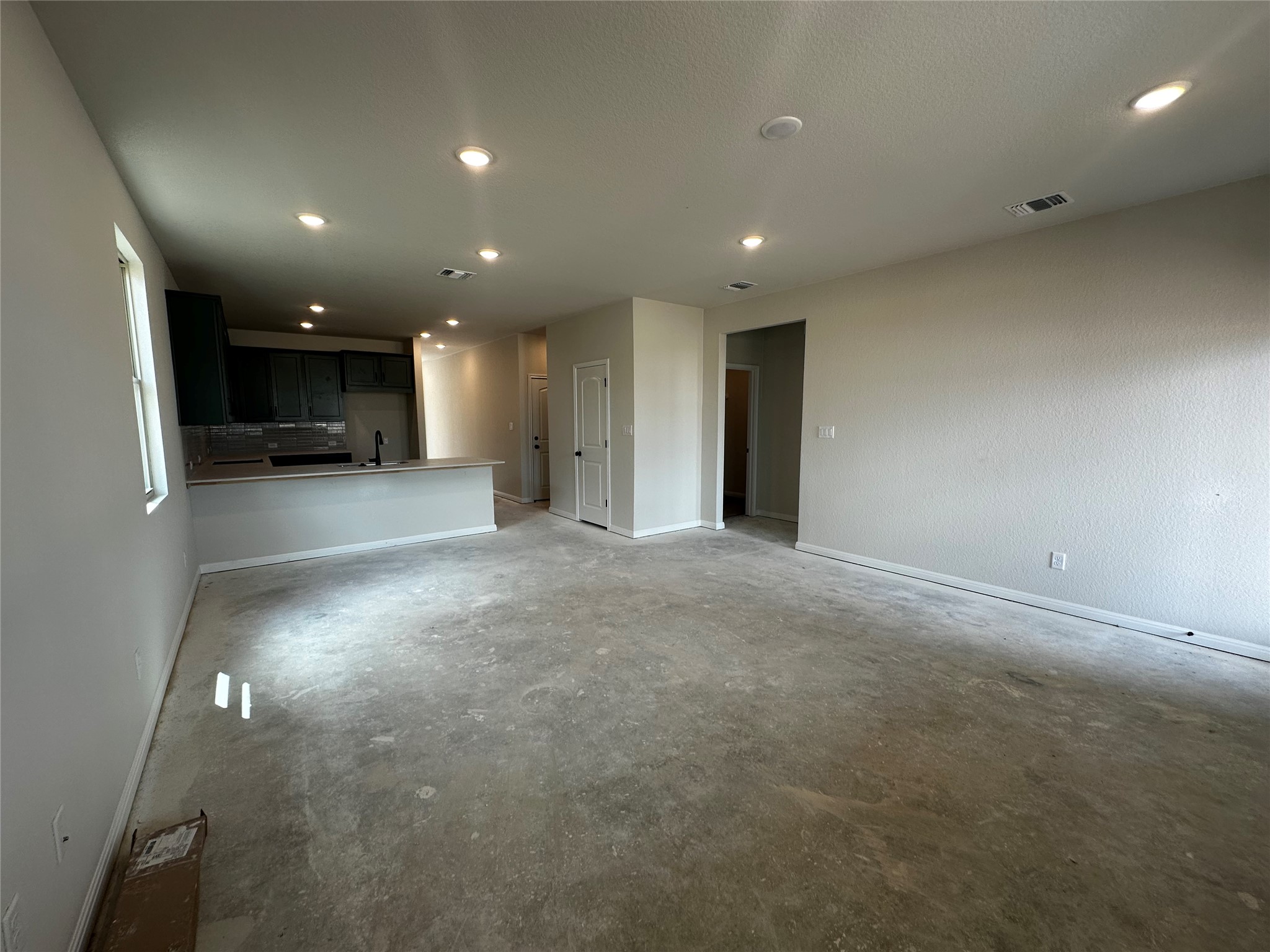 1053 Sienna Bear Road Georgetown, TX 78633 - Photo 10 of 32 a view of a big room with stainless steel appliances